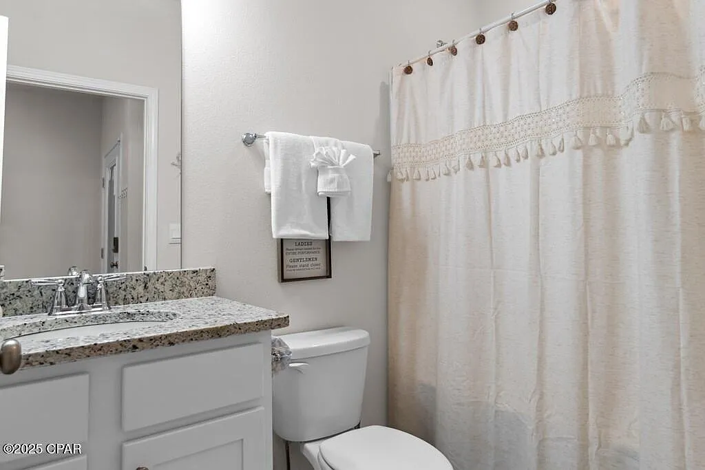 Clean bathroom with granite countertop